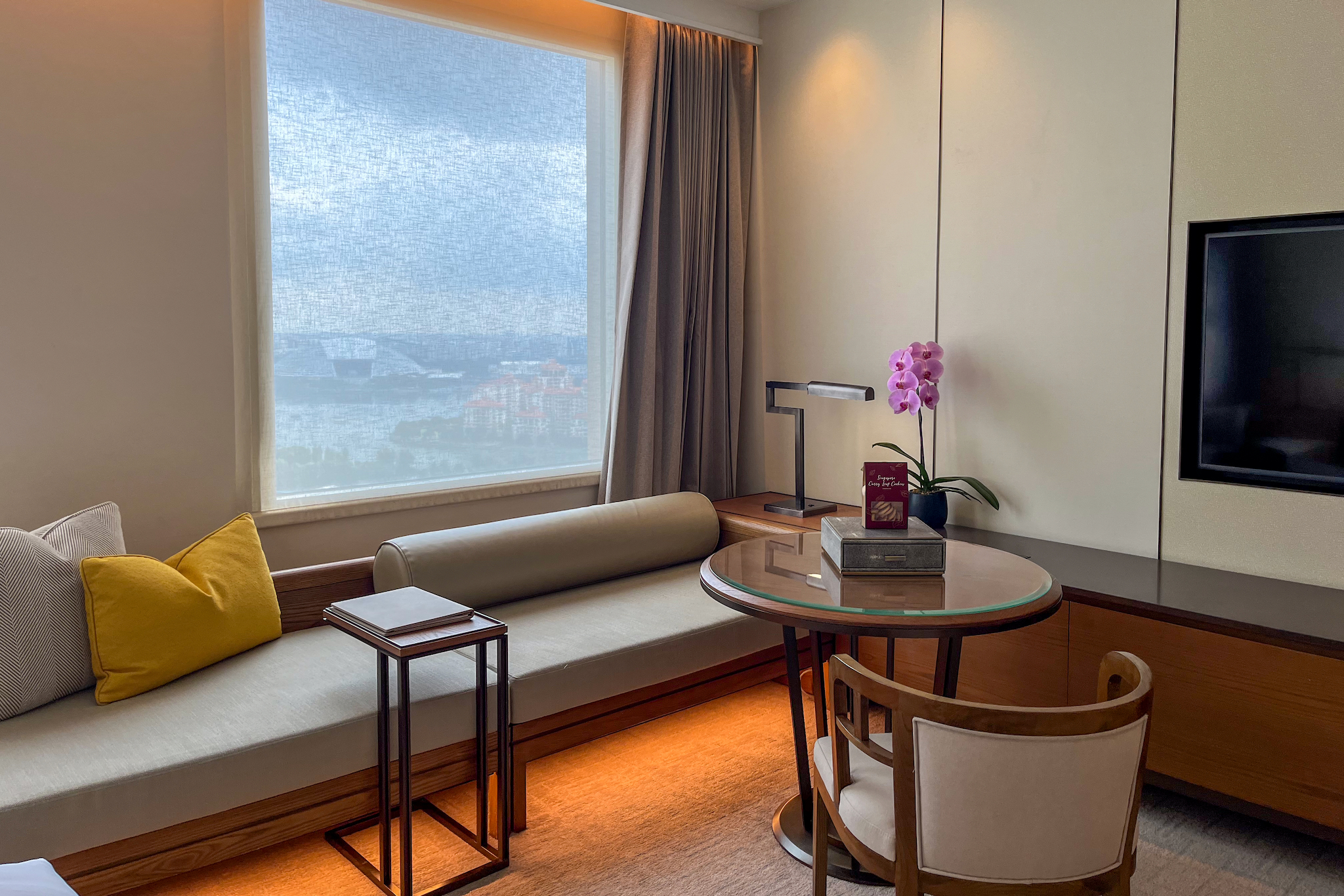 Sideboard and sofa by the window overlooking the stadium