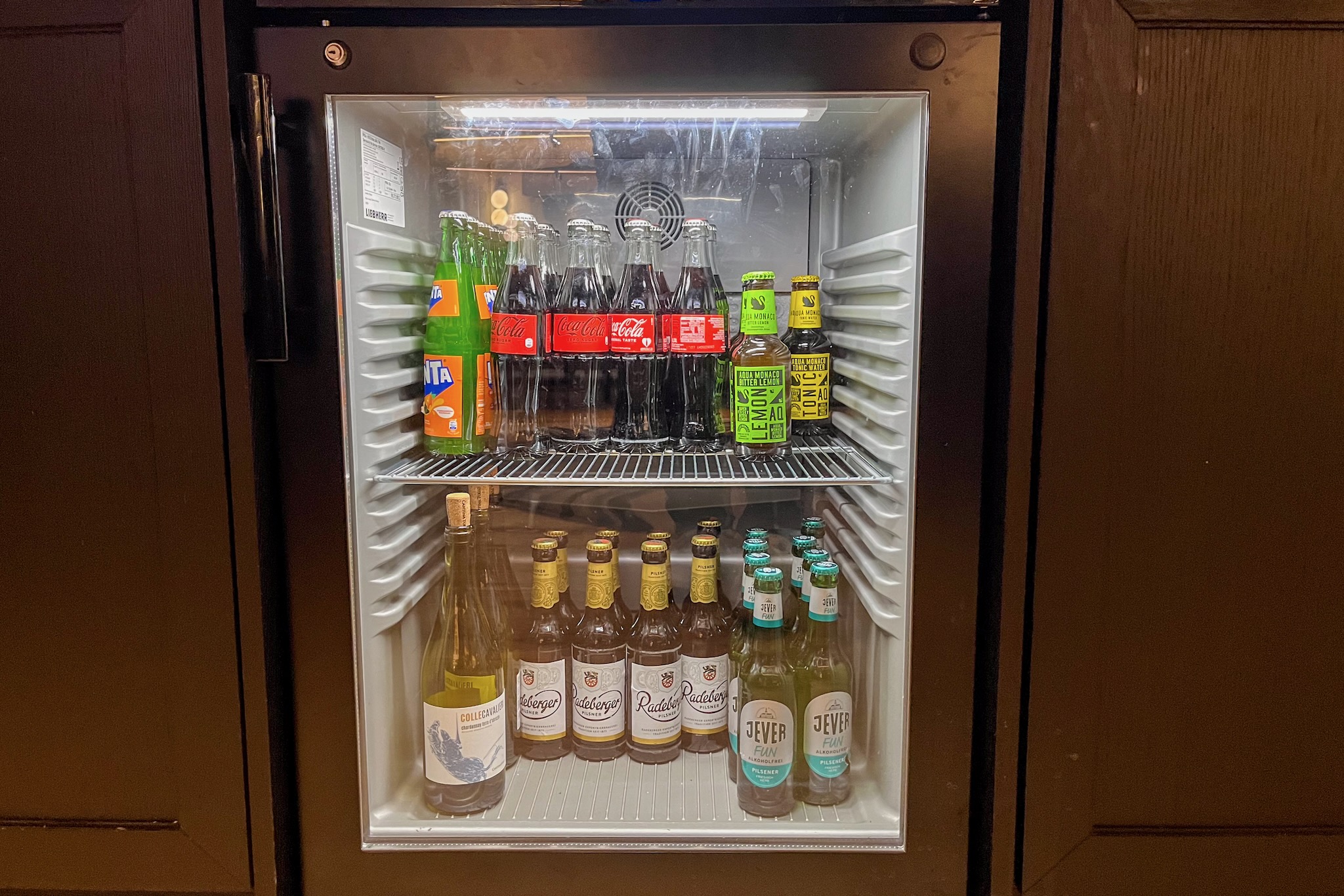 Drinks fridge with soft drinks and beer Beverage refrigerator with soft drinks and beer
