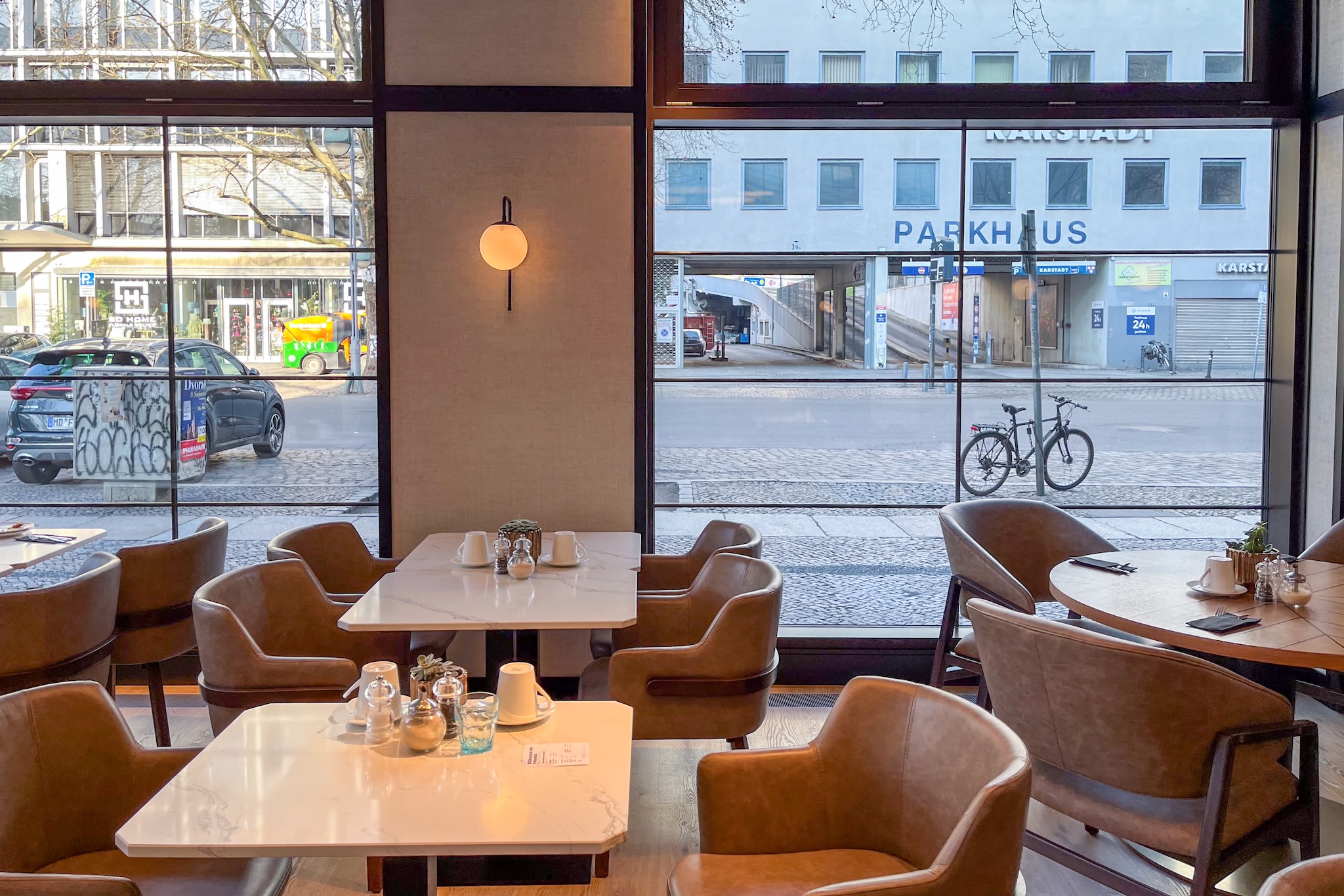 light-flooded restaurant through floor-to-ceiling windows Light-flooded restaurant through floor-to-ceiling windows
